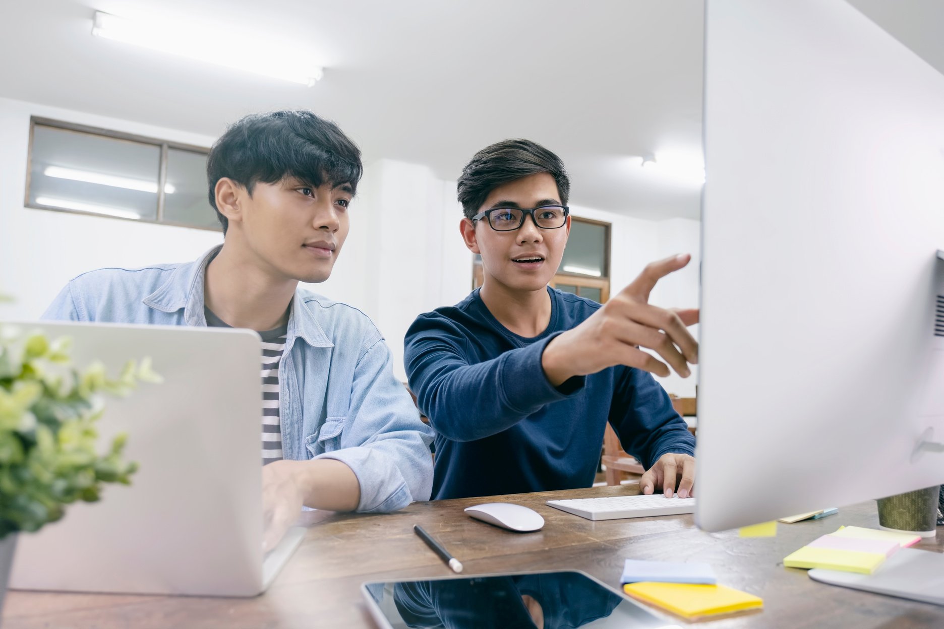 Programmers Working on a Project on the Computer